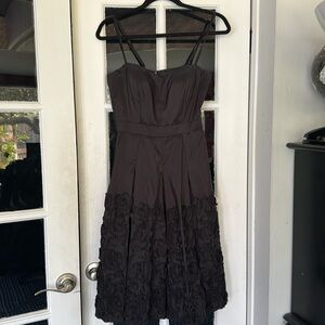 Black kick pleat dress, size 6, ribbon seen detail on skirt